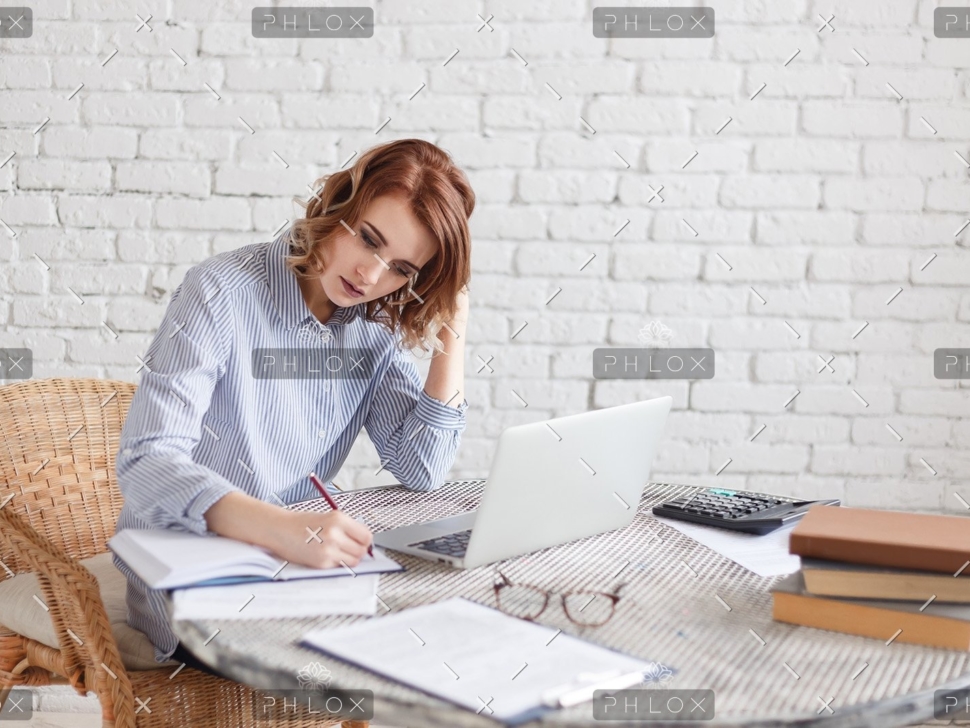 woman-freelancer-female-hands-with-pen-writing-on-P369BAX1